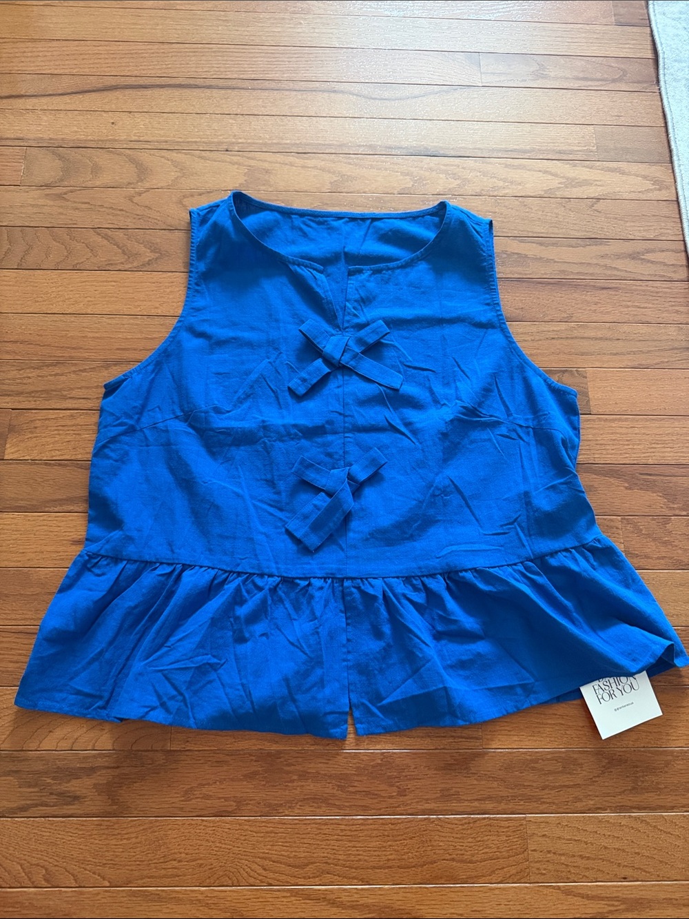 Blue Sleeveless Peplum Top with Front Bow Details -